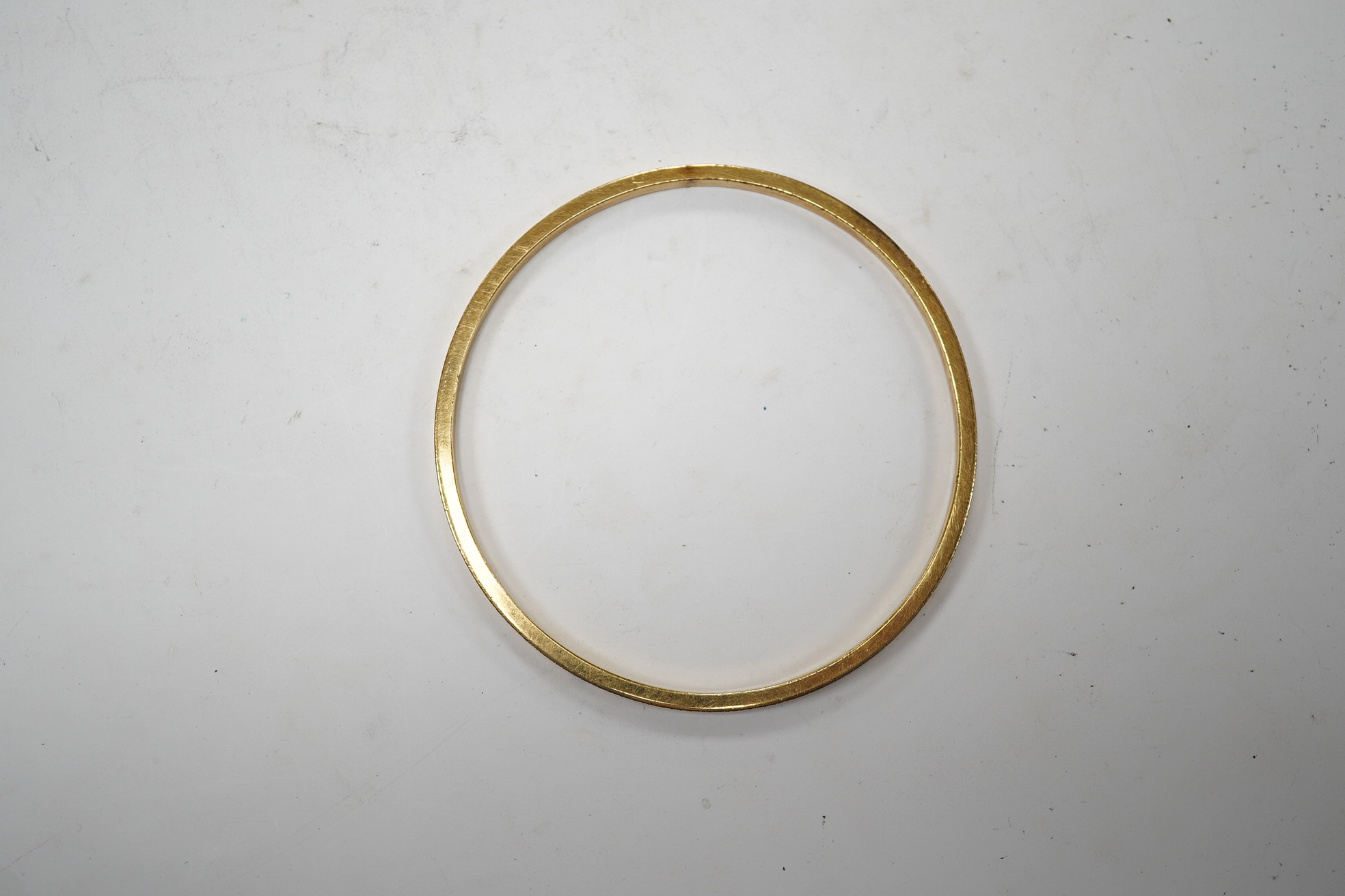 A yellow metal bangle, 5.3 grams, Condition - fair